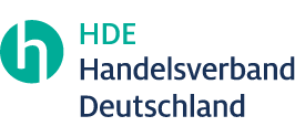 Logo des Handelsverbandes Deutschland (HDE) mit stilisiertem "H" in einem Kreis links und dem ausgeschriebenen Namen "Handelsverband Deutschland" rechts daneben.